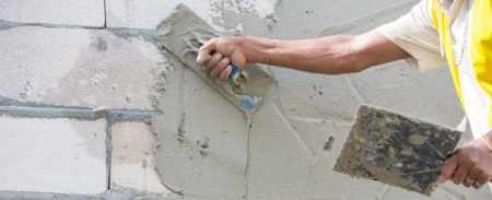Applying of base coat of plastering for brick masonry