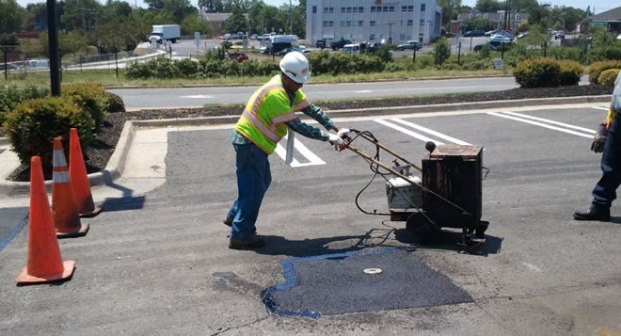 Repair of potholes in bituminous road