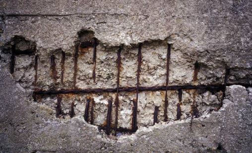 Spalling of Concrete Due to Corrosion of Steel Bars in Aggressive Environment